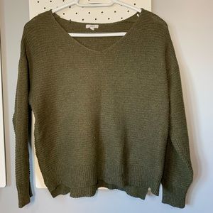 green knitted v neck sweater